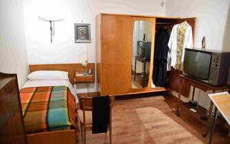 The bedroom of late priest Pino Puglisi is pictured in the historic house museum and "Padre Nostro" welcome center in the Brancaccio district of Palermo, Sicily, on September 14, 2018 on the eve of the Pope's visit to the Diocese. - Pope Francis is to pay a one-day pastoral visit on September 15 the Dioceses of Piazza Armerina and Palermo in Sicily, on the occasion of the 25th anniversary of the killing by the mafia of Sicilian priest Pino Puglisi. (Photo by Andreas SOLARO / AFP)        (Photo credit should read ANDREAS SOLARO/AFP via Getty Images)