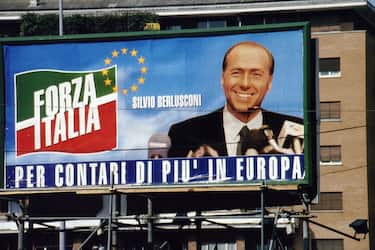 ROME, ITALY - MAY 12:  A poster showing the face of Prime Minister Silvio Berlusconi and the symbol of Forza Italia paty for the European elections campaign on May 12, 1994 in Rome, Italy.  (Photo by Franco Origlia/Getty Images)