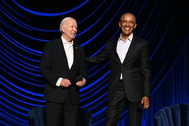 US President Joe Biden (L) laughs with former US President Barack Obama onstage during a campaign fundraiser at the Peacock Theater in Los Angeles on June 15, 2024. (Photo by Mandel NGAN / AFP) (Photo by MANDEL NGAN/AFP via Getty Images)