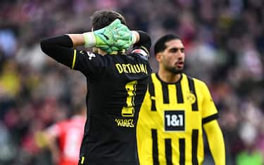 01 April 2023, Bavaria, Munich: Soccer: Bundesliga, Bayern Munich - Borussia Dortmund, Matchday 26, Allianz Arena, Dortmund's Emre Can (r) and Gregor Kobel react after conceding the goal to make it 0-1. IMPORTANT NOTE: In accordance with the requirements of the DFL Deutsche Fußball Liga and/or the DFB Deutscher Fußball-Bund, it is prohibited to use or have used photo recordings made in the stadium and/or of the match in the form of sequence pictures and/or video-like photo series. Photo: Tom Weller/dpa