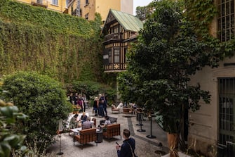 MILAN, ITALY - APRIL 15: Guests chill after visiting the exhibition "L'Appartamento" by Artemest, located at Residenza Vignale, during the Milan Design Week 2024 on April 15, 2024 in Milan, Italy. Every year, the Salone Internazionale del Mobile and Fuorisalone define the Milan Design Week, the worldâ  s largest annual furniture and design event. Centered on principles of circular economy, reuse, and sustainable practices and materials, the Fuorisaloneâ  s 24 theme:Â â  Materia Naturaâ  , seeks to foster a culture of mindful design. (Photo by Emanuele Cremaschi/Getty Images)