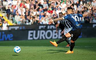Inter s Lautaro Martinez (R) takes the penalty during the Italian Serie A soccer match Udinese Calcio vs FC Internazionale at the Friuli - Dacia Arena stadium in Udine, Italy, 1 May 2022. ANSA/GABRIELE MENIS