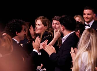 French director Justine Triet (C) reacts as she wins the Palme d'Or for the film "Anatomie d'une Chute" (Anatomy of a Fall) during the closing ceremony of the 76th edition of the Cannes Film Festival in Cannes, southern France, on May 27, 2023. (Photo by Valery HACHE / AFP) (Photo by VALERY HACHE/AFP via Getty Images)