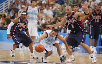 ATHENS - AUGUST 27:  Alejandro Ariel Montecchia #6 of Argentina dives for the ball under pressure from Carlos Boozer #7 of United States in the men's basketball semifinal game on August 27, 2004 during the Athens 2004 Summer Olympic Games at the Indoor Hall of the Olympic Sports Complex in Athens, Greece. Argentina won 89-81.  (Photo by Chris McGrath/Getty Images) *** Local Caption *** Alejandro Ariel Montecchia;Carlos Boozer;Allen Iverson