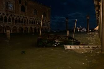 VENICE, ITALY - NOVEMBER 12: A jetty of gondoliers sails in Piazza San Marco after the passage of the exceptional high tide that reached 187 cm on November 12, 2019 in Venice, Italy. High tide, or acqua alta as it is more commonly known, stood at 126 centimeters this morning. (Photo by Stefano Mazzola/Awakening/Getty Images)
