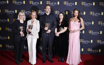epa11901790 (L-R) Stephanie Guillon, Frederique Arguello, Pierre Olivier Persin and Marilyne Scarselli pose with British actor Hannah John-Kamen (far right) in the press room after winning the Best Make Up and Hair award for 'The Substance' during the BAFTA Film Awards at the Royal Festival Hall in London, Britain, 16 February 2025. The ceremony is hosted by the British Academy of Film and Television Arts (BAFTA).  EPA/TOLGA AKMEN