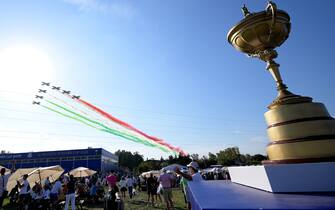 Italian Air Force (Aeronautica Militare)'s aerobatic demonstration team, the Frecce Tricolori (lit.Tricolour Arrows), show a colourful vapour trail as they fly over a large statue of the trophy during the Opening Ceremony of the 2023 Ryder Cup golf tournament  at Marco Simone Golf Club in Guidonia, near Rome, Italy, 28 September 2023. The 44th Ryder Cup matches between the US and Europe will be held in Italy from 29 September to 01 October 2023.   ANSA/ETTORE FERRARI