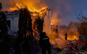 epa11330772 Ukrainian rescuers work to extinguish a fire at the site of an overnight missile strike on private buildings in Kharkiv, northeastern Ukraine, 10 May 2024, amid the Russian invasion. Kharkiv was hit by an S-300 missile at night, Mayor Ihor Terekhov wrote on telegram. At least two people, a 11-year-old child and a 72-year-old woman, were injured in the attack, according to the head of the Kharkiv Regional Military Administration, Oleg Synegubov. Russian troops entered Ukrainian territory on 24 February 2022, starting a conflict that has provoked destruction and a humanitarian crisis.  EPA/SERGEY KOZLOV