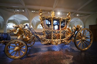 The Gold State Coach on display at the Royal Mews in Buckingham Palace, London, ahead of King Charles III's Coronation on May 6. The King and Queen Consort will travel to the coronation in the modern Diamond Jubilee State Coach and return in the historic Gold State Coach. Picture date: Tuesday April 4, 2023. (Photo by Yui Mok/PA Images via Getty Images)