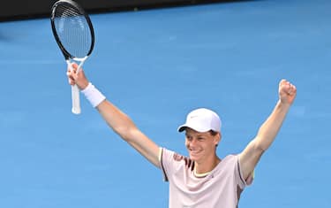 epa11105009 Jannik Sinner of Italy celebrates match point during his Men's semifinal win over Novak Djokovic of Serbia on Day 13 of the 2024 Australian Open at Melbourne Park in Melbourne, Australia 26 January 2024.  EPA/JAMES ROSS AUSTRALIA AND NEW ZEALAND OUT