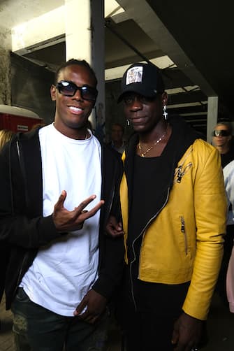 MILAN, ITALY - SEPTEMBER 23: Enock Barwuah and Mario Balotelli attend the afterparty of the Philipp Plein SS23 Fashion Show during the during the Milan Fashion Week Womenswear Spring/Summer 2023 on September 23, 2022 in Milan, Italy. (Photo by Ferda Demir/Getty Images for Philipp Plein)