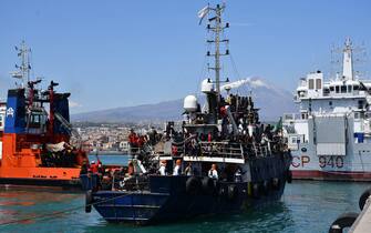 The fishing boat carrying about 600 migrants rescued in recent days 100 miles off the coast of Sicily towed by a tugboat arrived in the port of Catania, Italy, 12 April 2023. The vessel was escorted by the 'Nave Peluso' of the Coast Guard. The migrants on board greeted their arrival with applause and whistles and shouts of 'Bella Italia'.
ANSA/Orietta Scardino