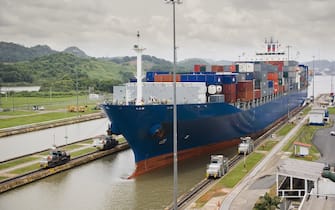 Cargo ship entering the Panama Canal at Miraflores Locks, Panama City, Central America
