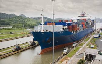 Cargo ship entering the Panama Canal at Miraflores Locks, Panama City, Central America