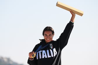 MARSEILLE, FRANCE - AUGUST 03: Marta Maggetti of Team Italy celebrates winning the Gold medal in the Women's Windsurf iQFoil class final on day eight of the Olympic Games Paris 2024 at Marseille Marina on August 03, 2024 in Marseille, France. (Photo by Clive Mason/Getty Images)