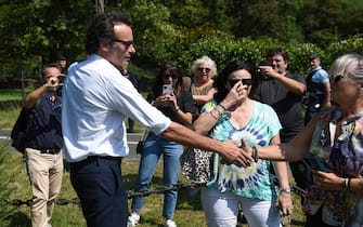 French actor Anthony Delon (L) greets his father's fans pior to a private funeral service inside the property of late French actor Alain Delon La Brulerie in Douchy, central France, on August 24, 2024. French film legend Alain Delon has died at the age of 88, his three children told AFP in a statement on August 18, 2024, following a battle with ill health. (Photo by GUILLAUME SOUVANT / AFP)