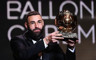 Real Madrid's French forward Karim Benzema receives the Ballon d'Or award during the 2022 Ballon d'Or France Football award ceremony at the Theatre du Chatelet in Paris on October 17, 2022. (Photo by FRANCK FIFE / AFP) (Photo by FRANCK FIFE/AFP via Getty Images)