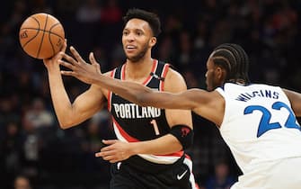 MINNEAPOLIS, MN - APRIL 01: Evan Turner #1 of the Portland Trail Blazers passes the ball away from Andrew Wiggins #22 of the Minnesota Timberwolves during the game on April 1, 2019 at the Target Center in Minneapolis, Minnesota. NOTE TO USER: User expressly acknowledges and agrees that, by downloading and or using this Photograph, user is consenting to the terms and conditions of the Getty Images License Agreement. (Photo by Hannah Foslien/Getty Images)