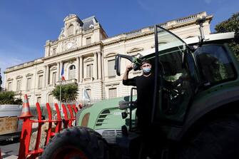 epa11105701 A French farmer poses in his tractor during a farmers' protest in front of prefecture of Montpellier, France, 26 January 2024. French farmers continue their protests with road blockades and demonstrations in front of state buildings awaiting a response from the government to their request for  immediate  aid of several hundred million euros. On 23 January, the EU Agriculture and Fisheries Council highlighted the importance of providing the conditions necessary to enable EU farmers to ensure food security sustainably and profitably, as well as ensuring a fair income for farmers.  EPA/GUILLAUME HORCAJUELO
