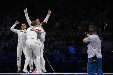 Team Italy celebrates winning against Team France in the women's epee team gold medal bout during the Paris 2024 Olympic Games at the Grand Palais in Paris, on July 30, 2024. (Photo by Fabrice COFFRINI / AFP) (Photo by FABRICE COFFRINI/AFP via Getty Images)