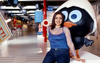 Italian actress, TV presenter and singer Ambra Angiolini posing with the advertising cartoon character Calimero before shooting the episodes of the TV show Caro Carosello. Rome, 1997