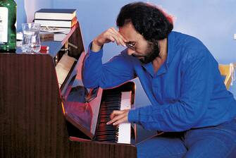 The Italian songwriter Antonello Venditti sitting in profile while playing a piano. Italy, 1984   (Photo by Angelo Deligio\Mondadori via Getty Images)