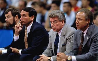 BARCELONA, SPAIN - 1992:  USA Men's National Basketball coaching staff (L-R) P.J. Carlisimo, Mike Krzyzewski, Chuck Daly and Lenny Wilkins look on from the bench during the 1992 Olympics in Barcelona, Spain.  NOTE TO USER: User expressly acknowledges and agrees that, by downloading and or using this photograph, User is consenting to the terms and conditions of the Getty Images License Agreement. Mandatory Copyright Notice: Copyright 1992 NBAE (Photo by Andrew D. Bernstein/NBAE via Getty Images)