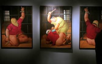 The paintings by Colombian artist Fernando Botero are displayed during the inauguration of his exhibition of 78 paintings on the Abu Ghraib prison in Iraq 31 January 2008 at the Parque Fundidora in Monterrey City, Mexico.   AFP PHOTO/Simon CORRAL / AFP / Simon CORRAL        (Photo credit should read SIMON CORRAL/AFP via Getty Images)