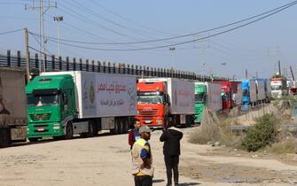 Trucks carrying humanitarian aid enter the Gaza Strip via the Rafah crossing with Egypt, hours after the start of a four-day truce in battles between Israel and Palestinian Hamas militants, on November 24, 2023. A four-day truce in the Israel-Hamas war began on November 24, with hostages set to be released in exchange for prisoners in the first major reprieve in seven weeks of war that have claimed thousands of lives. (Photo by SAID KHATIB / AFP) (Photo by SAID KHATIB/AFP via Getty Images)