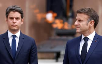 epa11419486 French President Emmanuel Macron (R) and France's Prime Minister Gabriel Attal (L) attend a ceremony marking the 84th anniversary of late French General Charles de Gaulle's World War II resistance call 'Appeal of 18 June' in 1940, at the Mont-Valerien memorial in Suresnes, outside Paris, France, 18 June 2024.  EPA/LUDOVIC MARIN / POOL  MAXPPP OUT