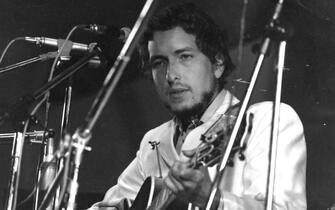 1969:  American singer-songwriter Bob Dylan in concert at the Isle of Wight Pop Festival.  (Photo by William Lovelace/Express/Getty Images)