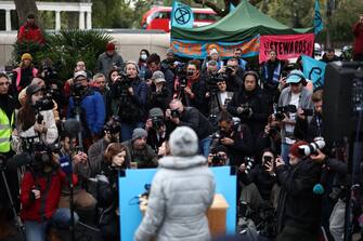 Members of the press gather as Swedish climate activist Greta Thunberg holds a press conference outside the InterContinental London Park Lane during the "Oily Money Out" demonstration organised by Fossil Free London and Greenpeace on the sidelines of the opening day of the Energy Intelligence Forum 2023 in London on October 17, 2023. (Photo by HENRY NICHOLLS / AFP) (Photo by HENRY NICHOLLS/AFP via Getty Images)