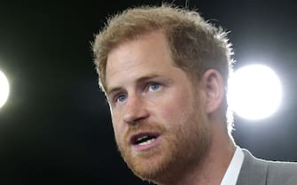 DUSSELDORF, GERMANY - SEPTEMBER 06: Meghan, Duchess of Sussex, Prince Harry, Duke of Sussex speak are presented with sports shirts with their children's names on them by Invictus athletes during the Invictus Games Dusseldorf 2023 - One Year To Go events, on September 06, 2022 in Dusseldorf, Germany. The Invictus Games is an international multi-sport event first held in 2014, for wounded, injured and sick servicemen and women, both serving and veterans. The Games were founded by Prince Harry, Duke of Sussex who's inspiration came from his visit to the Warrior Games in the United States, where he witnessed the ability of sport to help both psychologically and physically. (Photo by Chris Jackson/Getty Images for Invictus Games Dusseldorf 2023)