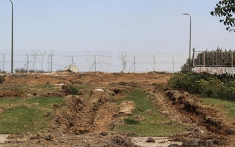 A breached section of the Gaza border security fence used by Hamas militants to cross into Israel near Kibbutz Be'eri, southern Israel, on Thursday, Oct. 13, 2023. As thousands of rockets and missiles rained onto the area, heavily armed Hamas militants went house-to-house killing and abducting families. Photographer: Jonathan Alpeyrie/Bloomberg