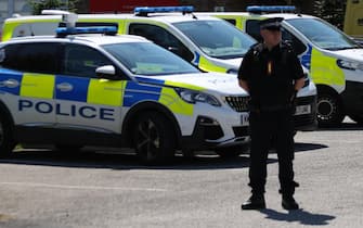 epa11505793 Police at the scene of suspected multiple stabbings at Meols Cop High School in Southport, Britain, 29 July 2024. Armed police detained a male and seized a knife after a number of people were injured in a reported stabbing according to Merseyside Police. Eight patients with stab injuries have been treated at the scene so far and have been taken to hospitals, North West Ambulance Service said.  EPA/ADAM VAUGHAN