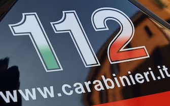 The 112 telephone number for emergency services is pictured on a car of the Italian Carabinieri police on March 21, 2019 in Crema, east of Milan. (Photo by Miguel MEDINA / AFP) (Photo by MIGUEL MEDINA/AFP via Getty Images)