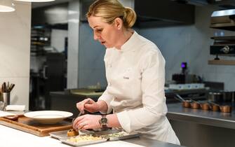 Clare Smyth, chef, prepares a dish of 'Potato and Roe' at the Core by Clare Smyth restaurant in the Notting Hill district of London, U.K., on Wednesday, Jan. 16, 2019. Smyth has worked under Alain Ducasse at the three-Michelin-star Louis XV in Monaco and was the guardian of Gordon Ramsay's three stars for almost a decade, the first woman ever to hold three stars in the U.K. Photographer: Miles Willis/Bloomberg via Getty Images