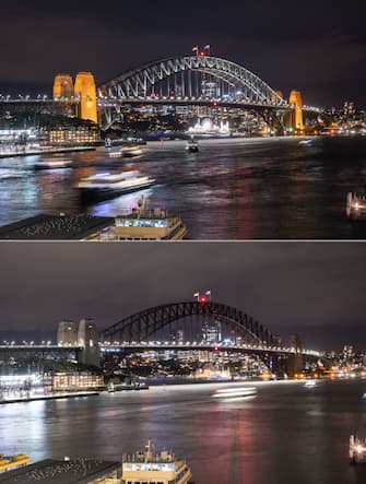 (COMBO) This combination of photographs shows the Sydney Harbour Bridge (bottom) with its lights switched off during the Earth Hour environmental campaign and after they were turned back on, in Sydney on March 25, 2023. (Photo by Wendell Teodoro / AFP) (Photo by WENDELL TEODORO/AFP via Getty Images)