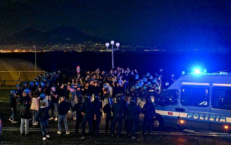 Some Ajax fans blocked by the Italian police on the Caracciolo waterfront, Naples, Italy, 11 October 2022. A fight with kicks, punches and bottle shots took place a little while ago in via Medina, in the center of Naples, between local fans and those of Ajax, the two teams that will face tomorrow in the Champions League challenge. ANSA / CIRO FUSCO