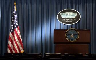 399192 06: The Pentagon logo and an American flag are lit up January 3, 2002 in the briefing room of Pentagon in Arlington, VA. (Photo by Alex Wong/Getty Images)