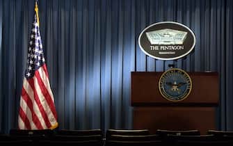 399192 06: The Pentagon logo and an American flag are lit up January 3, 2002 in the briefing room of Pentagon in Arlington, VA. (Photo by Alex Wong/Getty Images)