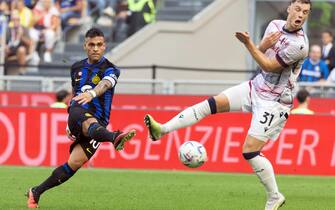 Inter Milan’s Lautaro Martinez (L) scores goal of 2 to 0 against Bologna’s Sam Beukema during the Italian serie A soccer match between Fc Inter  and Bologna Giuseppe Meazza stadium in Milan, 7 October 2023.
ANSA / MATTEO BAZZI