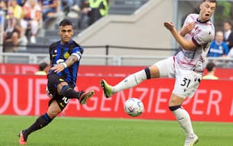 Inter Milan’s Lautaro Martinez (L) scores goal of 2 to 0 against Bologna’s Sam Beukema during the Italian serie A soccer match between Fc Inter  and Bologna Giuseppe Meazza stadium in Milan, 7 October 2023.
ANSA / MATTEO BAZZI