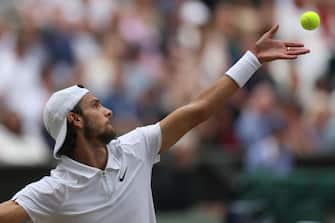 epa11474690 Lorenzo Musetti of Italy in action during his Men's Singles semifinal match against Novak Djokovic of Serbia at the Wimbledon Championships, Wimbledon, Britain, 12 July 2024.  EPA/NEIL HALL  EDITORIAL USE ONLY