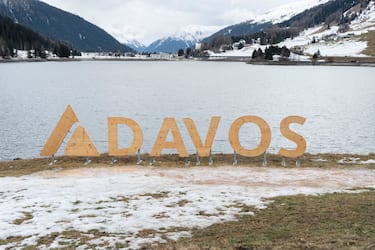 A wooden sign on the waterfront of Lake Davos in Davos, Switzerland, on Sunday, Jan. 8, 2023. Though its perched at an altitude of 1,560 meters, this years rare winter heatwave saw the Swiss town of Davos basking in temperatures well above freezing in early January, with its mountainsides covered in dead, brown grass and hikers out with their dogs. Photographer: Francesca Volpi/Bloomberg via Getty Images