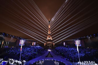 PARIS, FRANCE - JULY 26: A Light Show takes place as The Olympic Rings on the Eiffel Tower are illuminated during the opening ceremony of the Olympic Games Paris 2024 at Place du Trocadero on July 26, 2024 in Paris, France. (Photo by Jamie Squire/Getty Images)