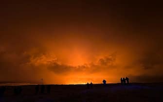 GRINDAVIK, ICELAND - DECEMBER 18: A volcano erupts on the Reykjanes Peninsula near the power station on December 18, 2023 north of Grindavik, Iceland. (Photo by Micah Garen/Getty Images)