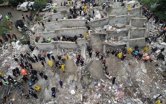 ADANA, TURKIYE - FEBRUARY 06: An aerial view shows search and rescue operation carried out at the debris of a building in Cukurova district of Adana after a 7.4 magnitude earthquake hit southern provinces of Turkiye, in Adana, Turkiye on February 6, 2023. (Photo by Eren Bozkurt/Anadolu Agency via Getty Images)
