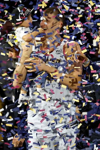 epa10687833 Denver Nuggets center Nikola Jokic and his daughter Ognjena celebrate on the NBA Championship podium as confetti drops after the Denver Nuggets defeated the Miami Heat in game five of the NBA Finals between the Miami Heat and the Denver Nuggets at Ball Arena in Denver, Colorado, USA, 12 June 2023. The Nuggets are NBA Champions for the first time in their franchise history.  EPA/JOHN G. MABANGLO  SHUTTERSTOCK OUT