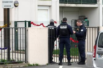 epa11044459 French police stand in front of a building where five bodies were found dead in Meaux, near Paris, France, 26 December 2023. Five bodies, of a mother and her four children were found dead by French police in an apartment on the evening of 25 December. Jean-Baptiste Bladier, the local prosecutor confirmed that a homicide investigation has been launched after the five bodies were found.  EPA/Christophe Petit Tesson